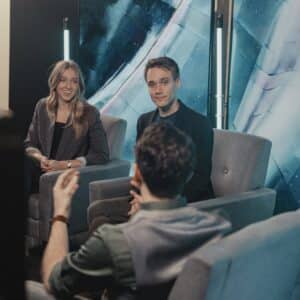 kate and calvin smiling while they are interviewed