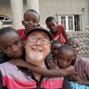 bob taking a selfie with kids he's serving in africa