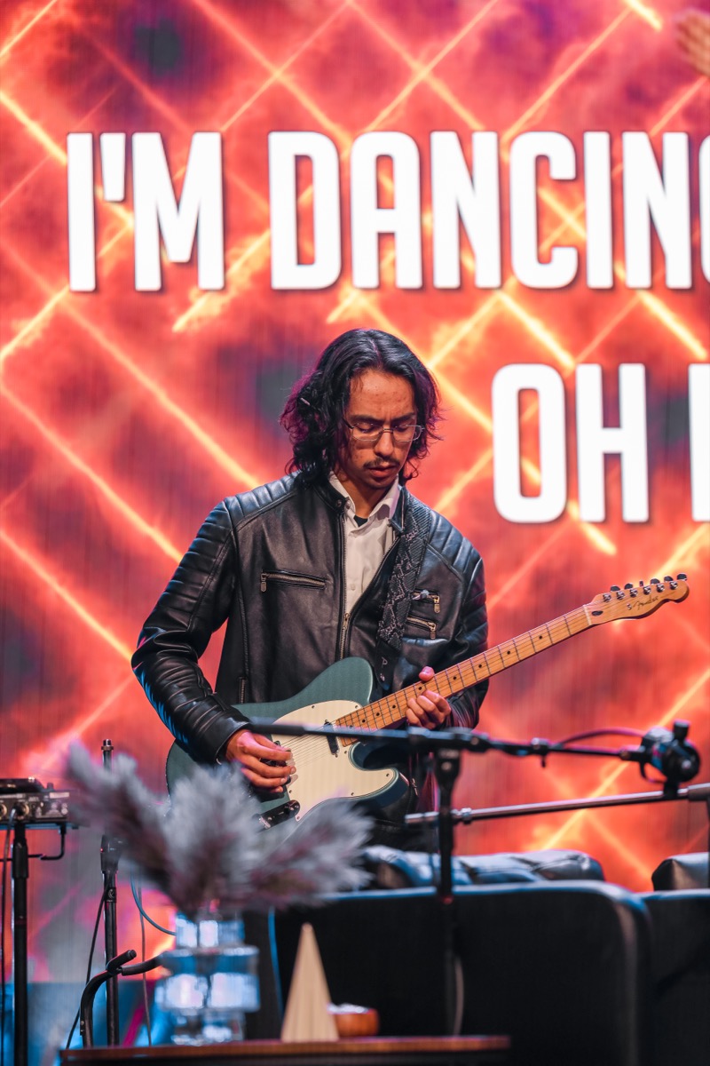 LPU guitarist performing during worship