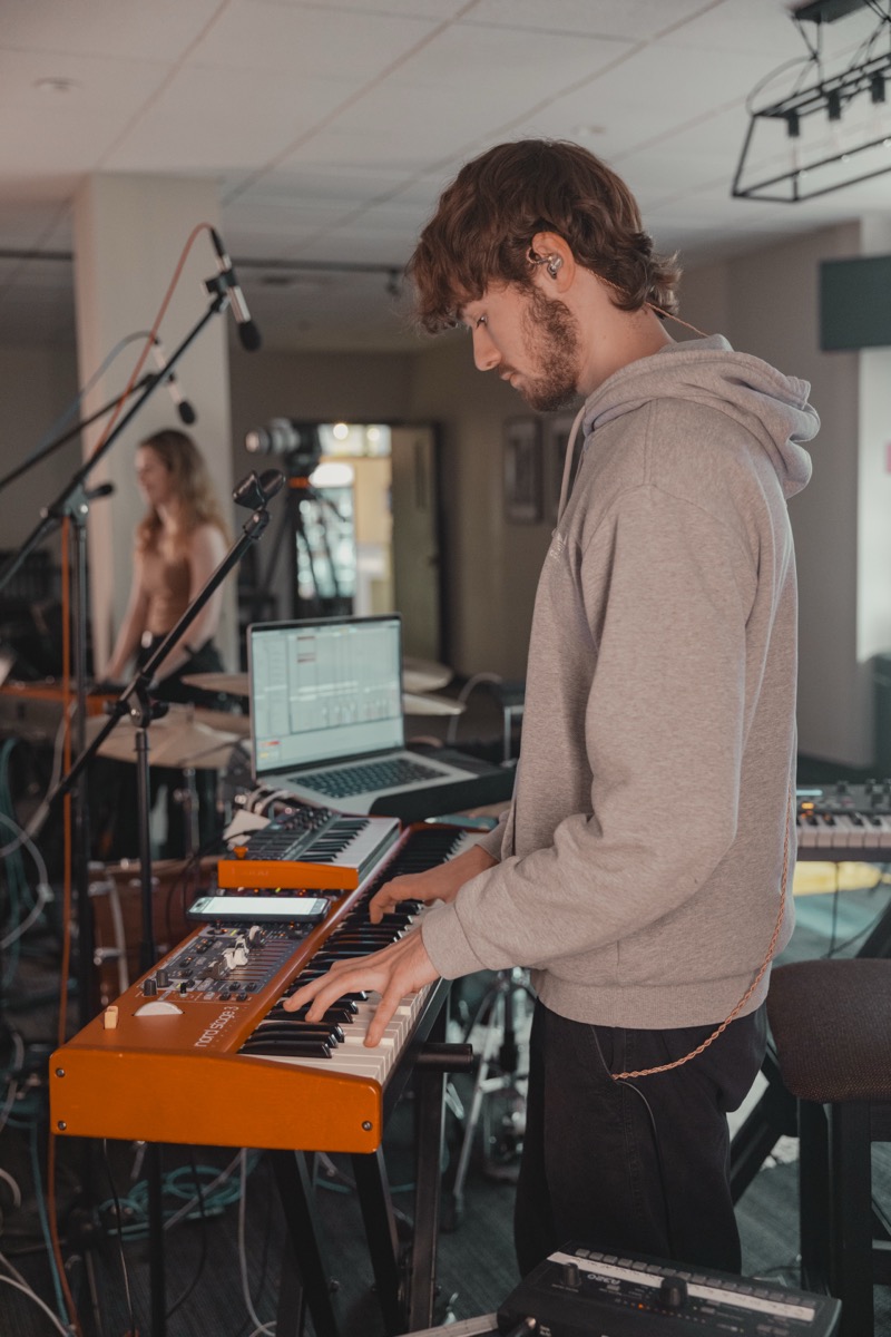 LPU keyboard player working with live music and production equipment