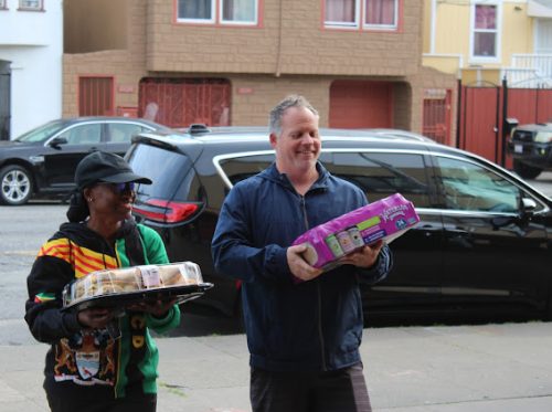 Noah Coombs and Tannise Collymore walk in food